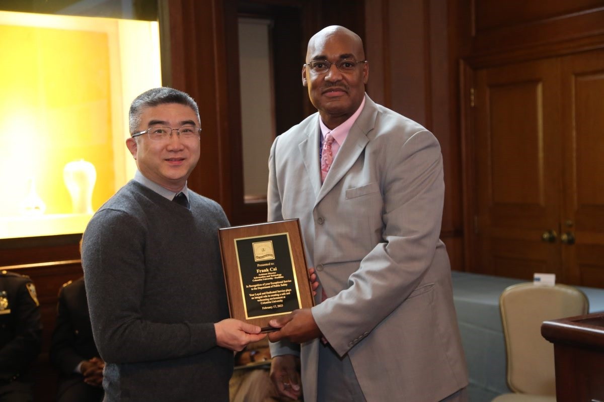 Frank Cai from Facilities Information and Technology was among the campus partners that received an exceptional service award. Frank Cai and Gerald Lewis Jr.