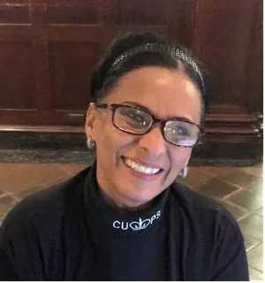 woman with CU PS turtleneck smiling