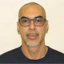 Portrait photo of PSO Jose Santana in front of white wall