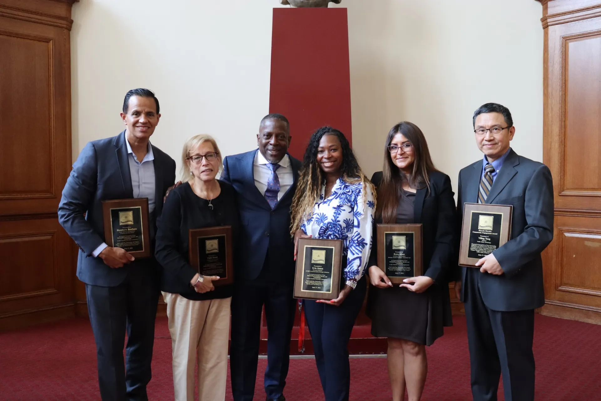 Humberto Bonfante, Vicki Dunn, Brian McPherson, Erin James, Rana Khan and Yiling Tang holding awards