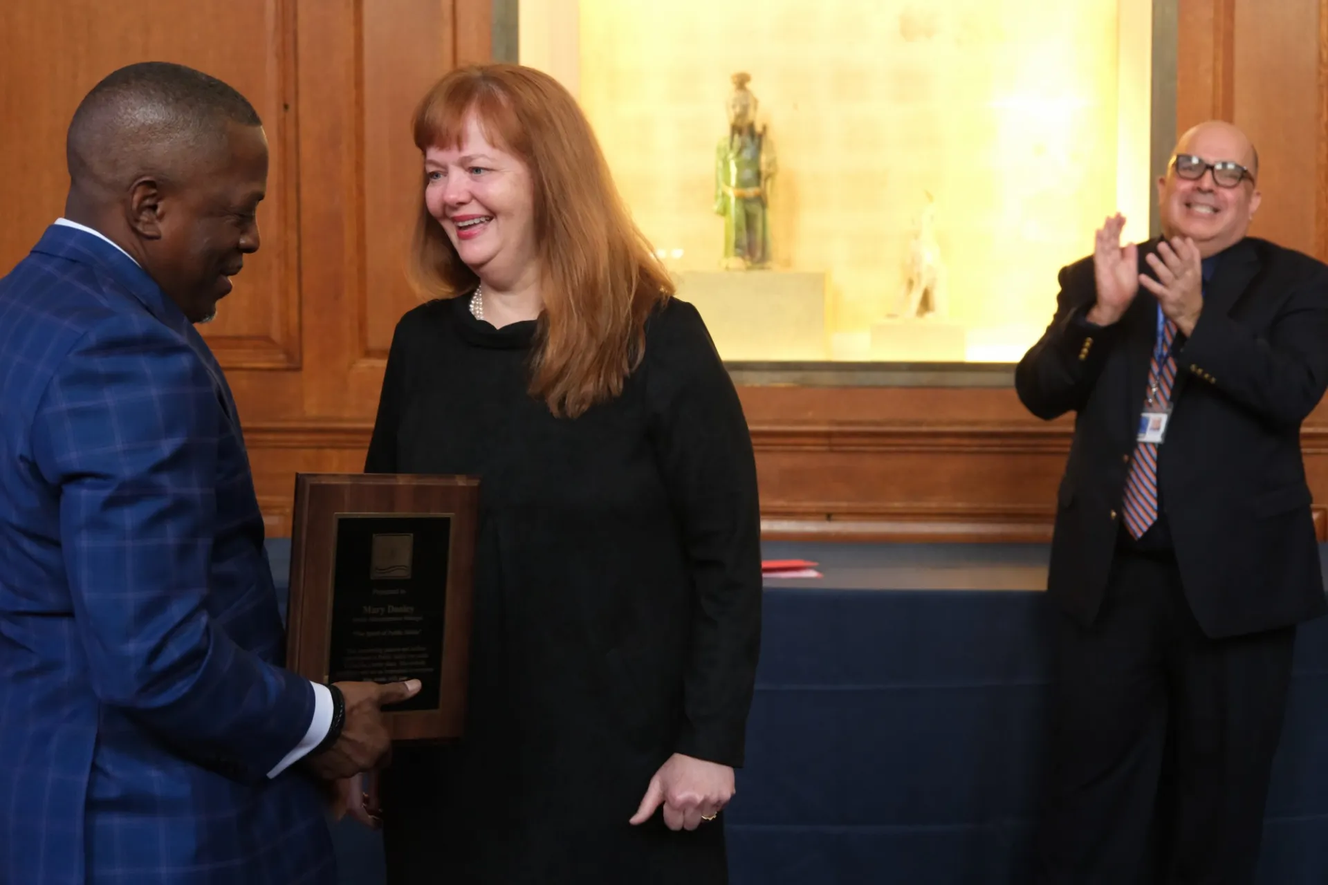 Mary Dooley accepts her plaque